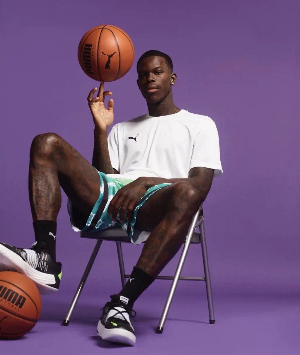 Schroder pictured with puma T-shirt, shoes and basketball after he signed an endorsement deal with the brand.