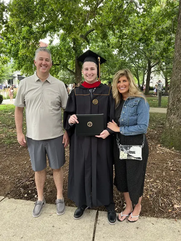 The basketball coach and his ex-wife from their son's graduation