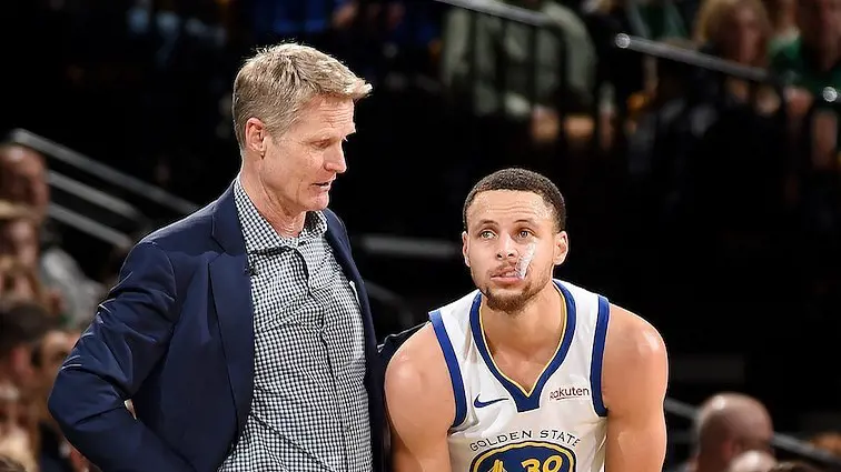 The Warriors coach with the Warriors all-time great Steph Curry